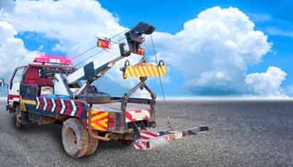 Wheel-Lift Tow Trucks are Compact Vehicles Equipped with an Attachment